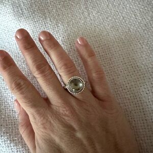 Pandora ring, size 7.  Great condition, silver with very pale green stone.